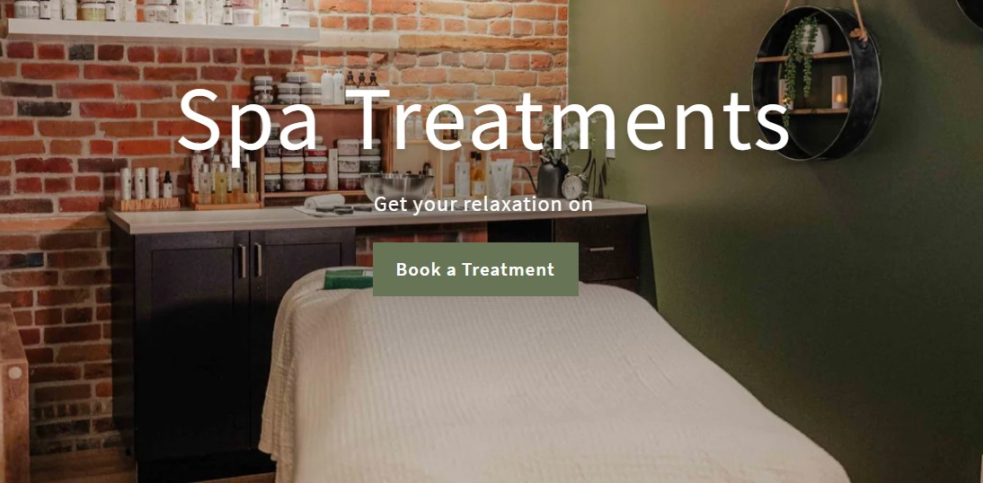 A serene spa setting adorned with spring blossoms, embodying tranquility and rejuvenation at Pure Organic Spa in downtown Cornwall.